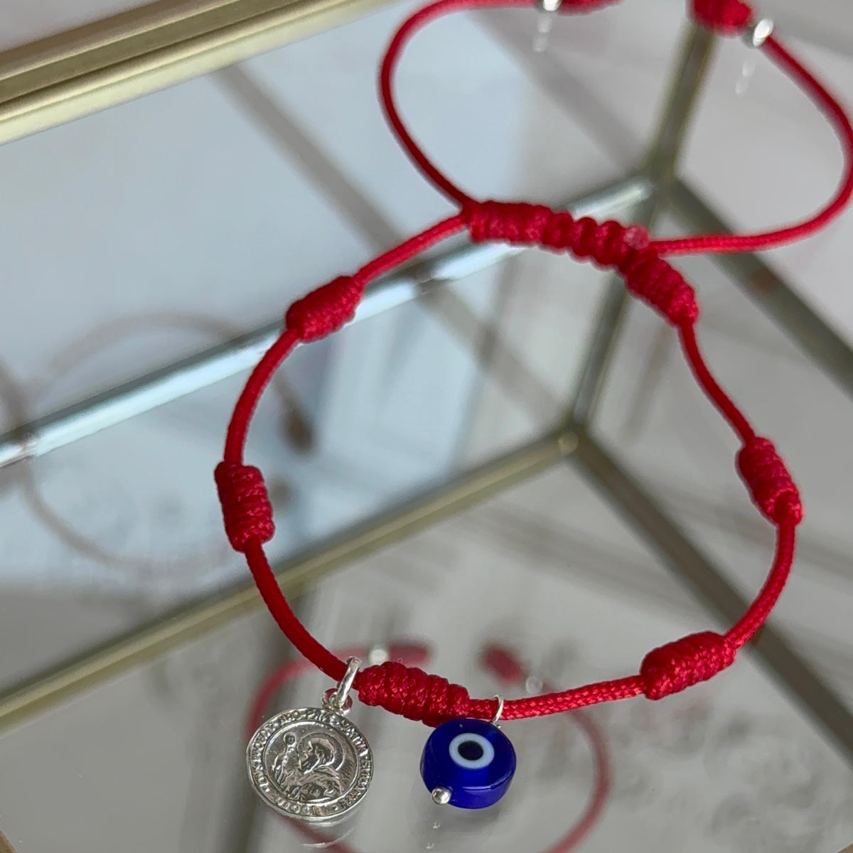 Pulsera Roja 7 Nudos con Ojo Turco y San Benito